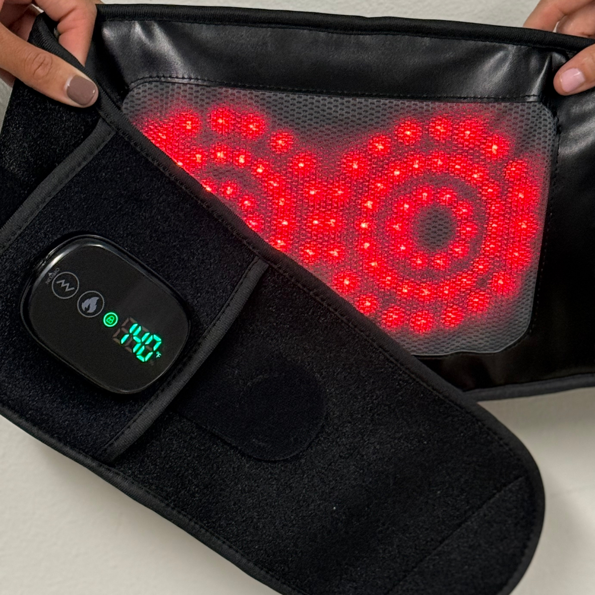 TheraBelt LED panel glowing red beside the controller display