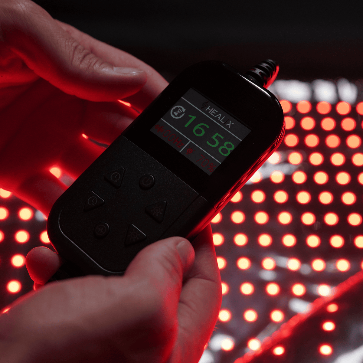 HEALiX Glow Pod controller close-up showing session timer above lit LEDs
