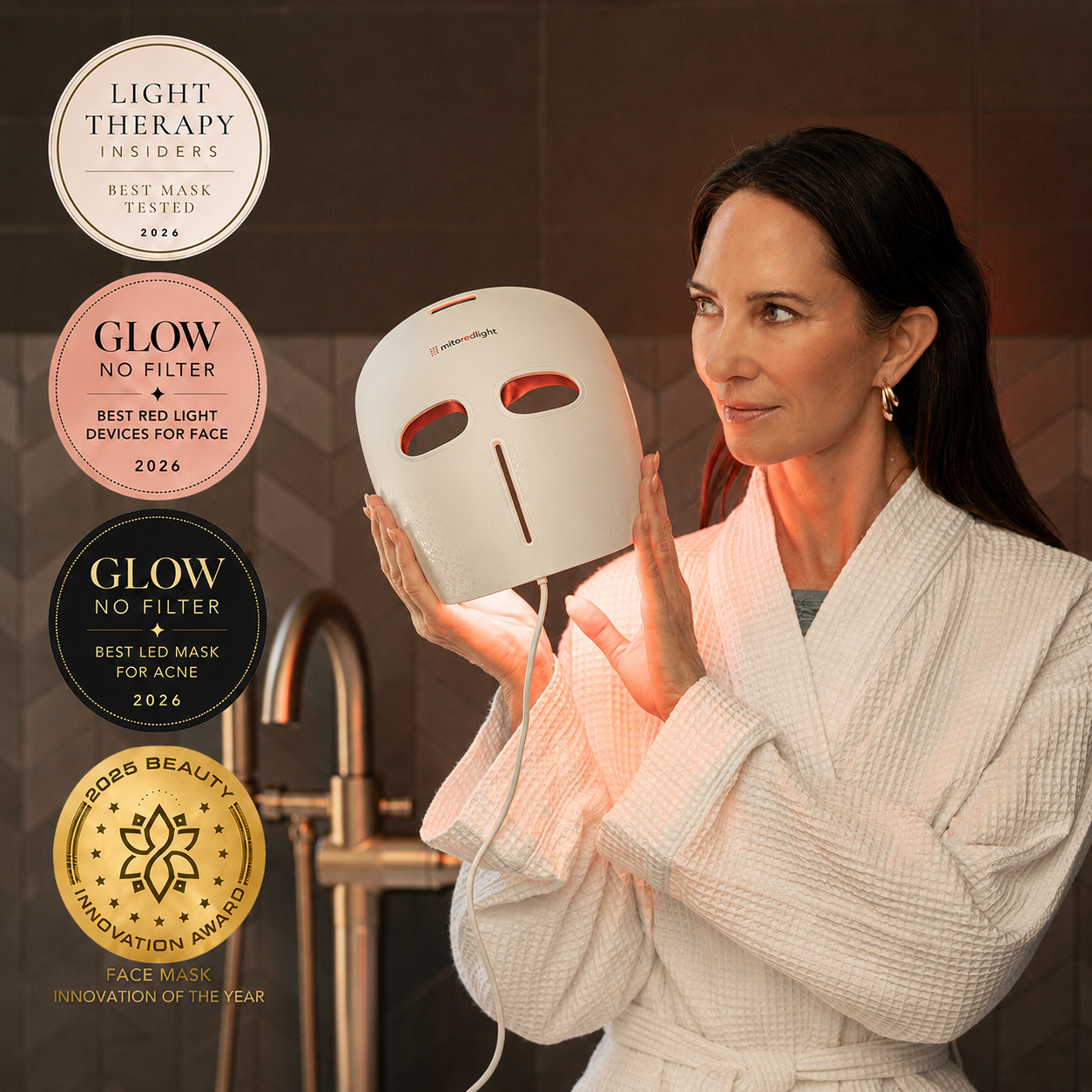 MitoGLOW mask held up in the bathroom with award badges