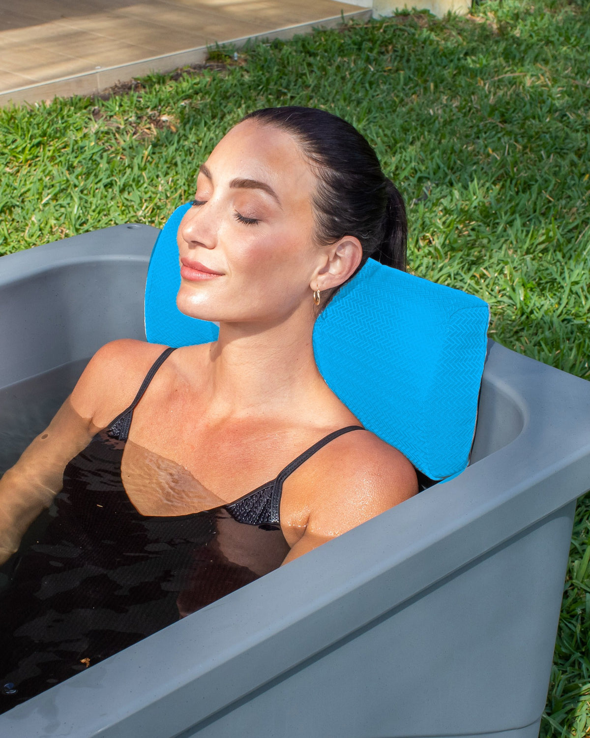 Frozin Cold Plunge Pillow in Havelock Blue, head resting on the pillow #Color_Havelock Blue