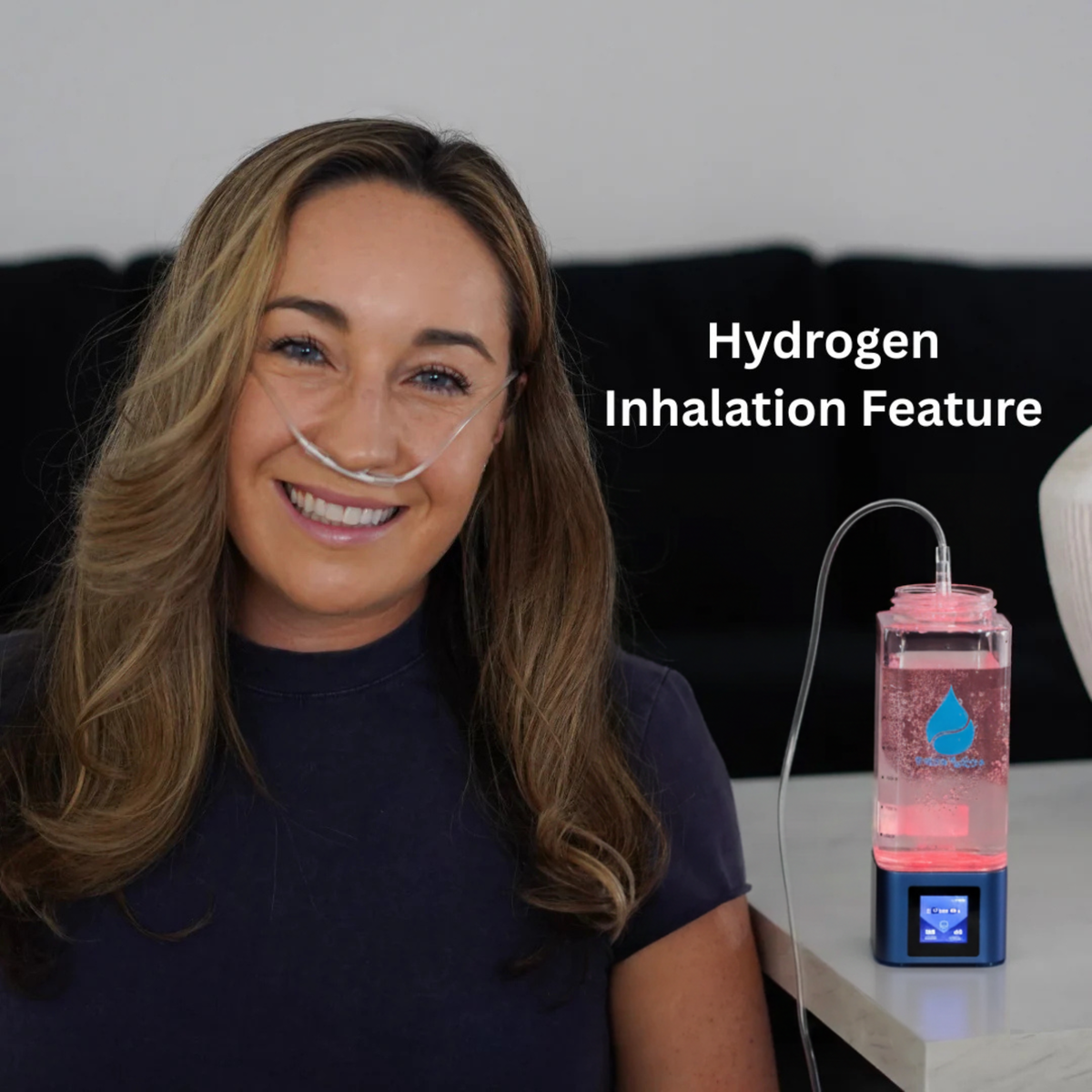 Woman breathing through the TheraH2Go+ inhalation tube
