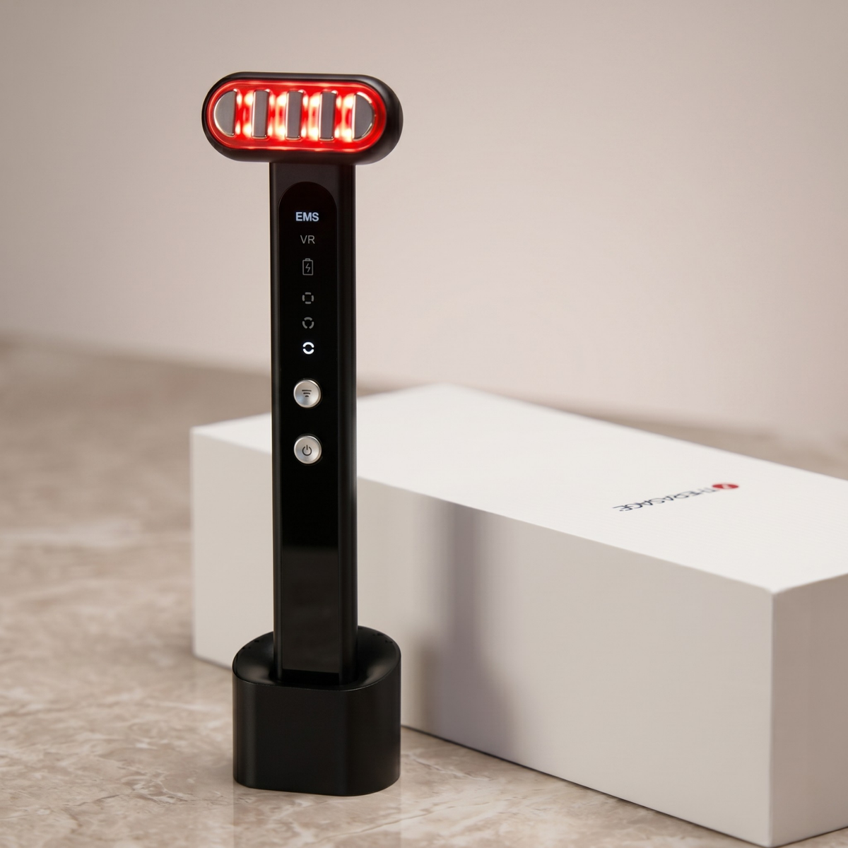 TheraSculpt in its charging stand glowing red beside its box