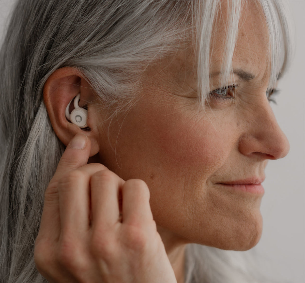 Close-up of an Ozlo Sleepbud 2 sitting flush in the ear