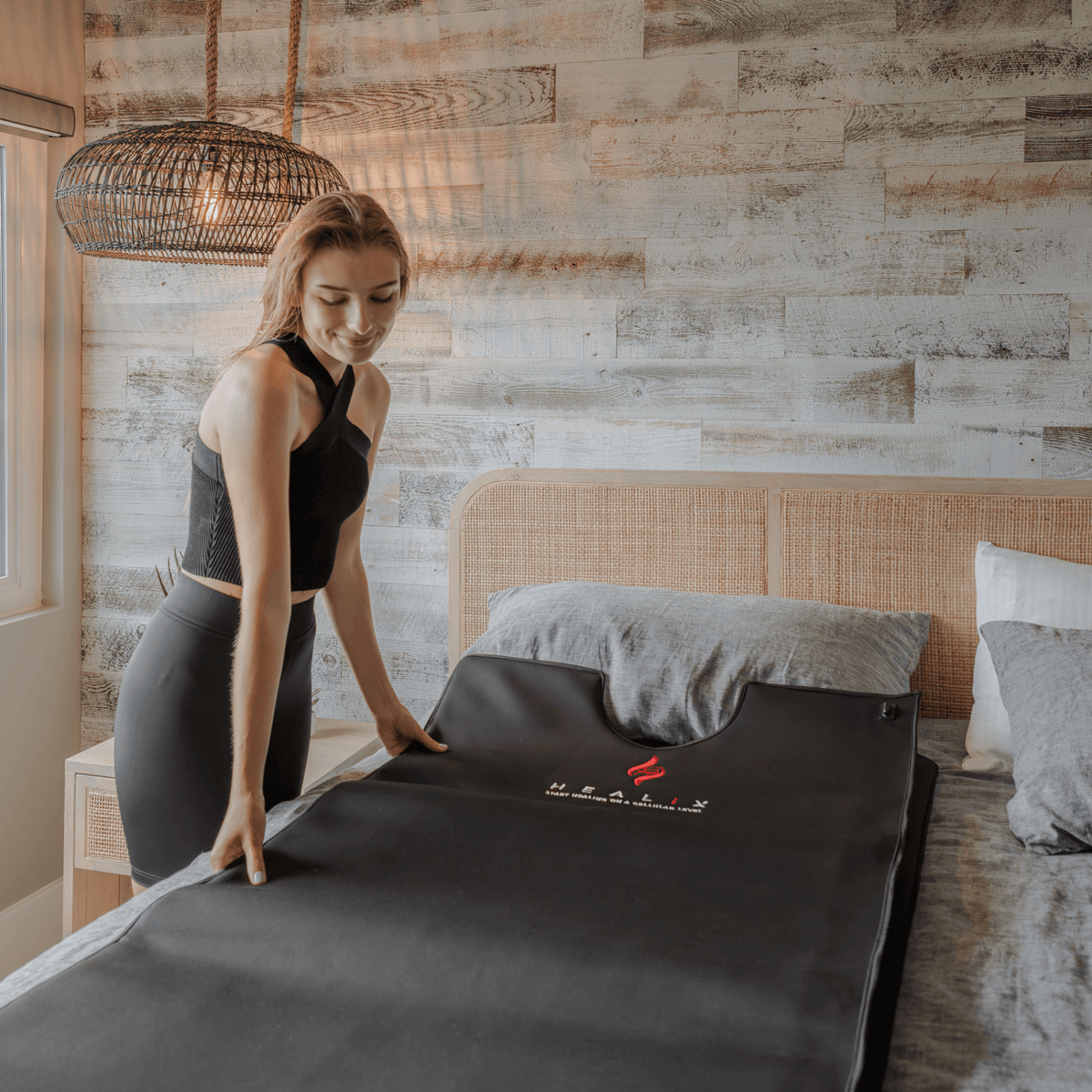 HEALiX Glow Pod being spread flat on a bed before a session