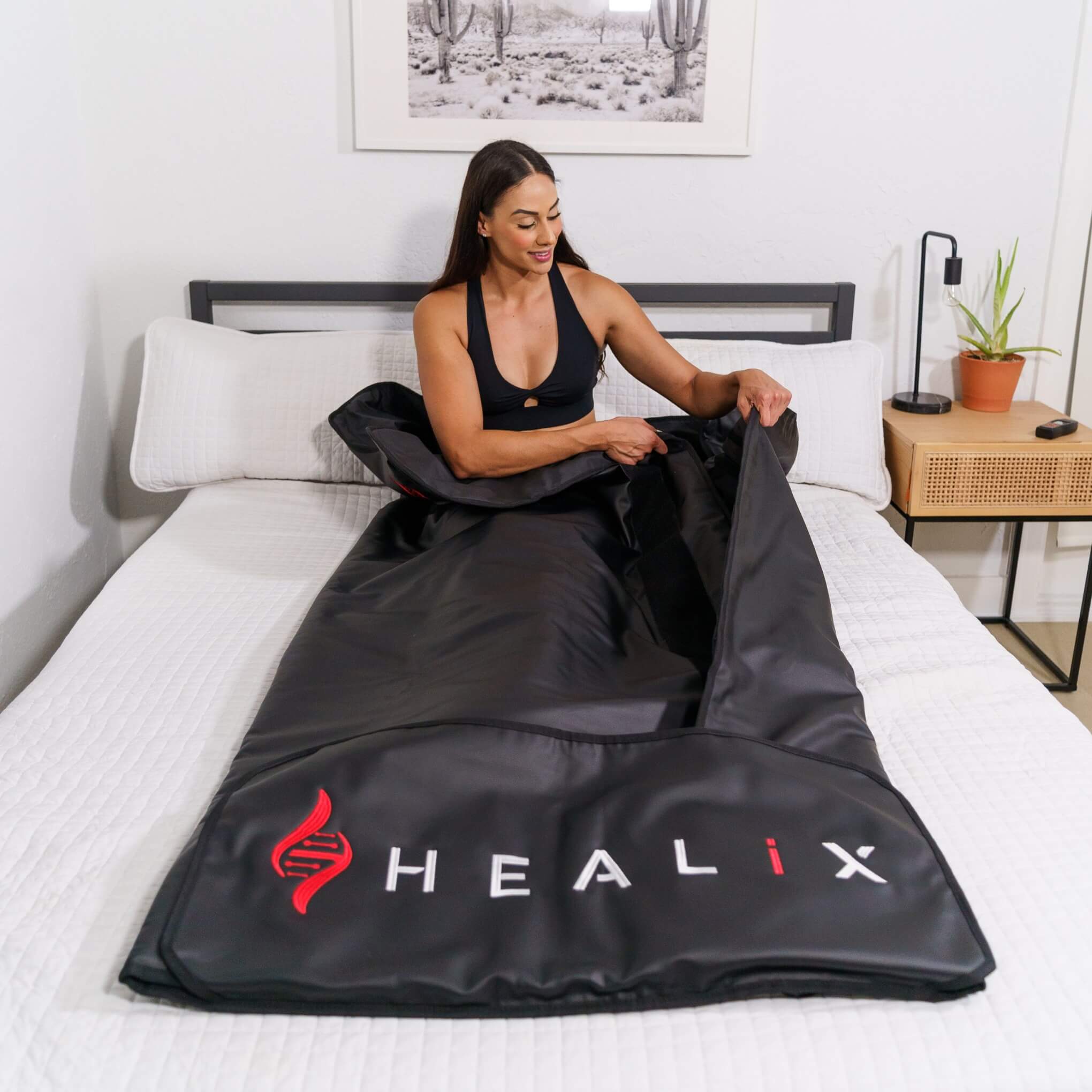 HEALiX Infrared Sauna Blanket opened on a bed before a sweat session