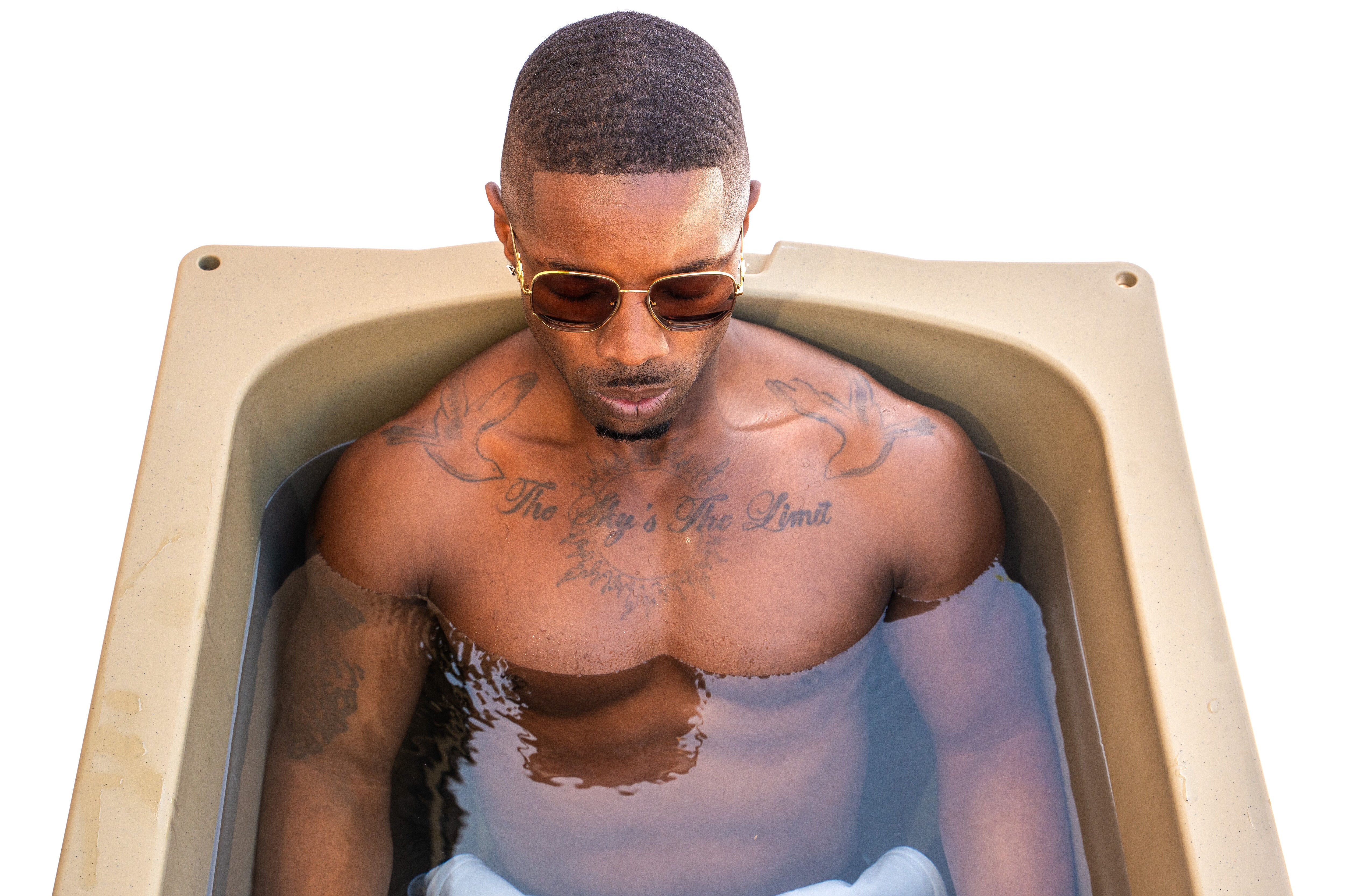 Relaxing in the Frozin 400 Tan cold plunge #Color_Tan