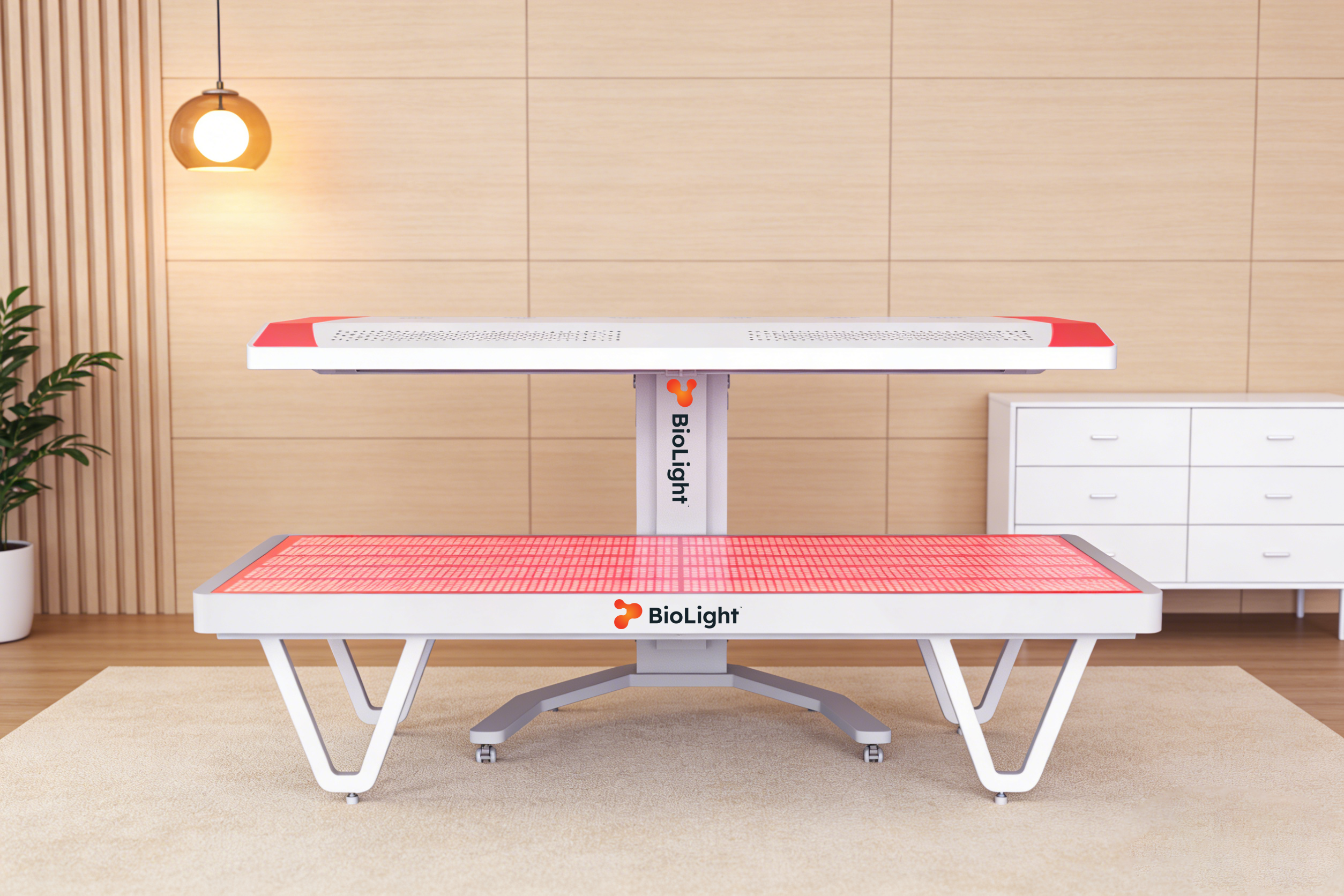 Front view of the BioLight Arc System with the base surface lit red beneath the raised overhead panel