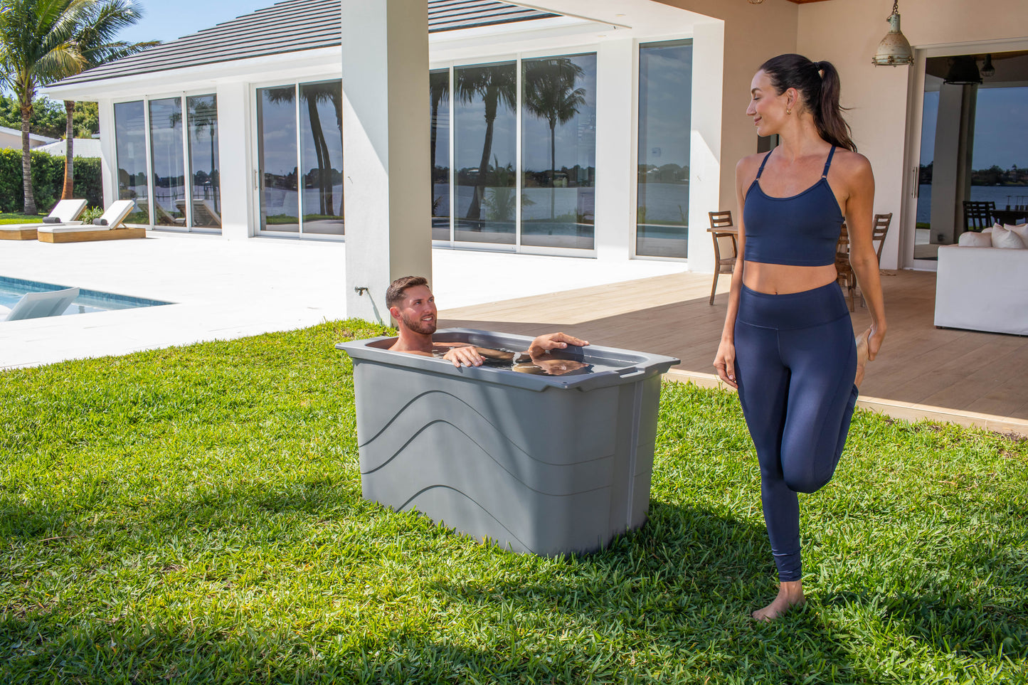 Frozin 400 grey granite cold plunge in a backyard with two people #Color_Grey Granite