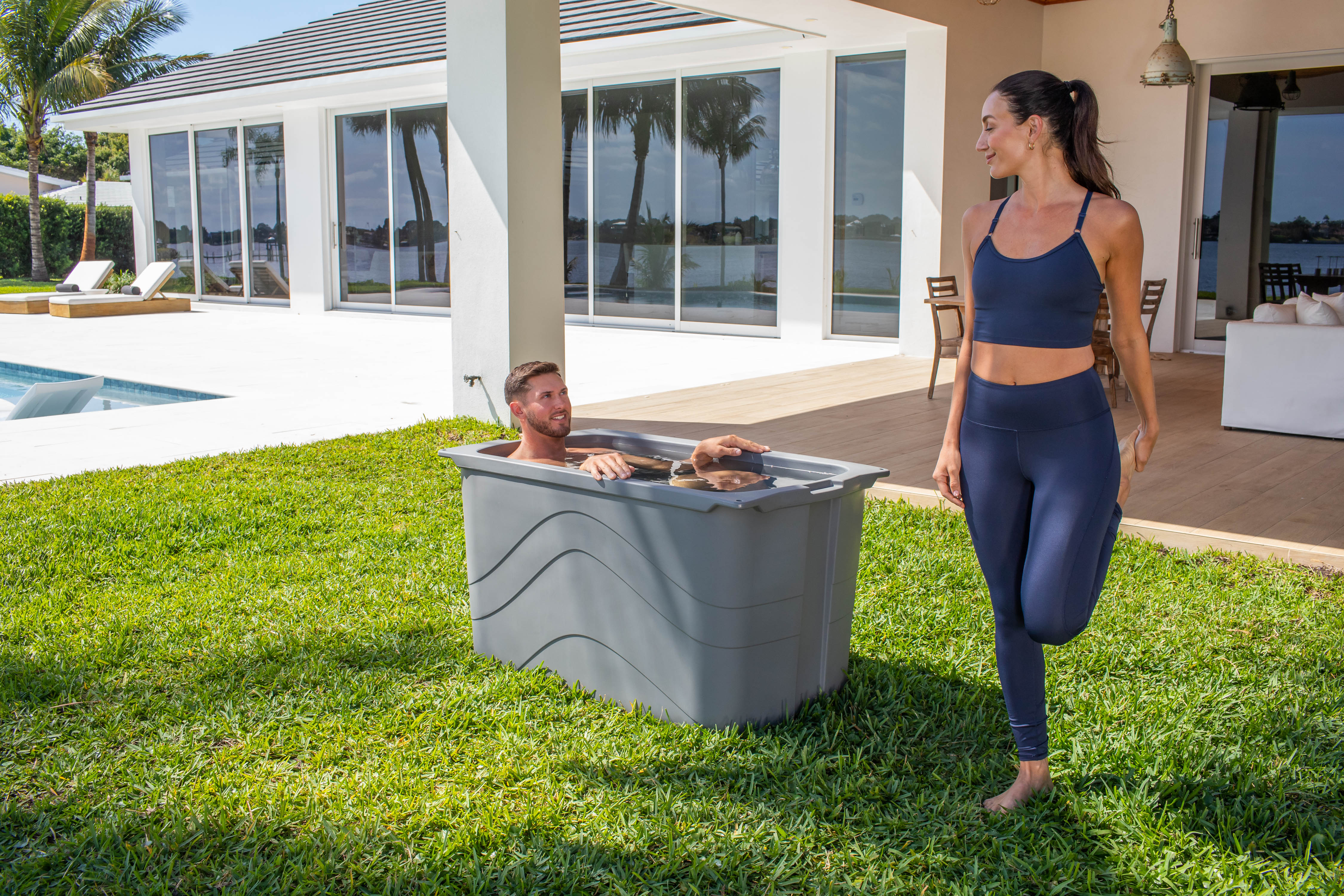 Frozin 400 grey granite cold plunge in a backyard with two people #Color_Grey Granite