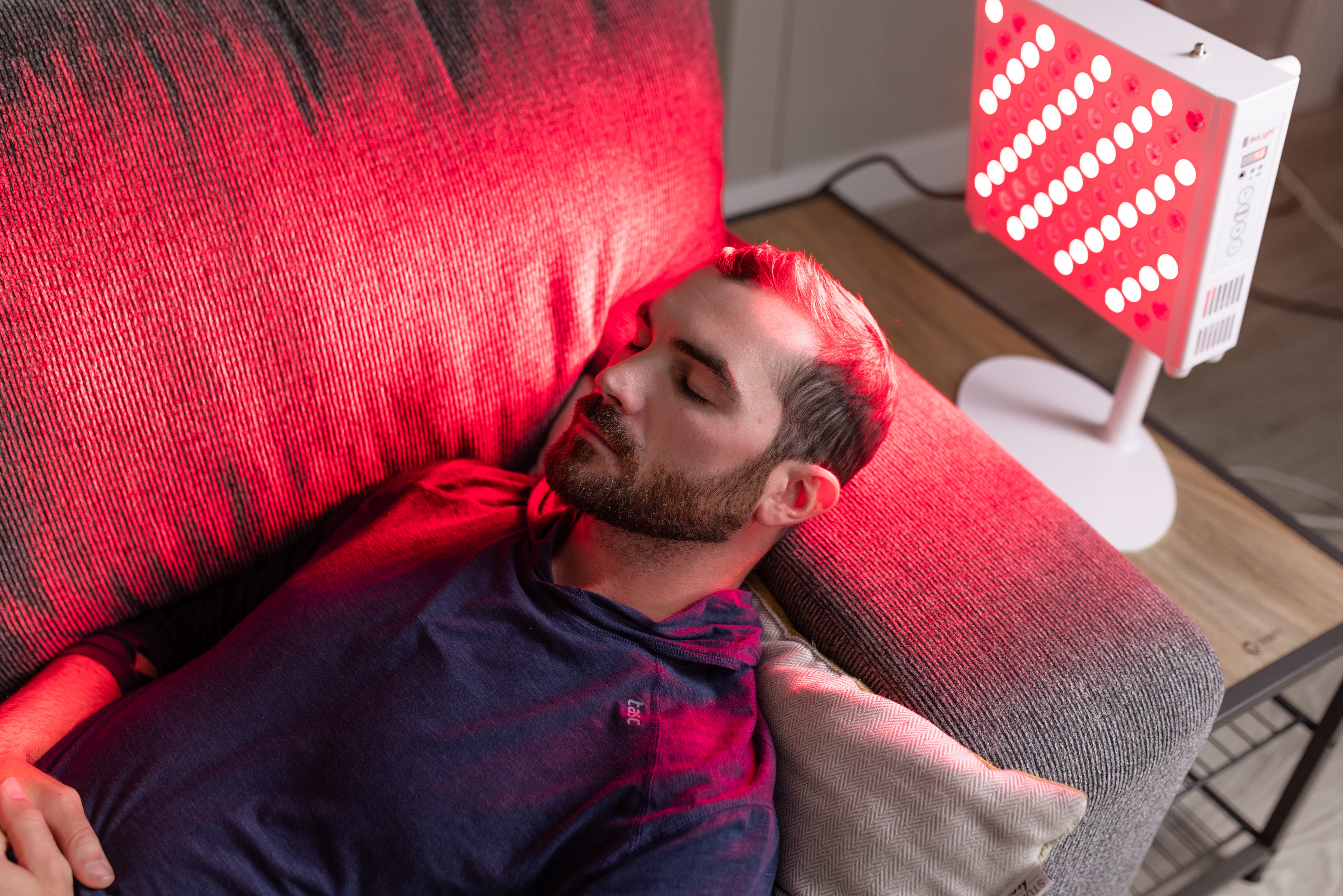 BioLight ReCharge panel on a side table during a couch session